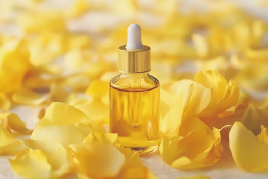 Wellness, aromatherapy beauty session, spa, glass bottle, aroma essential oil, flower petals. Spring fresh smell.