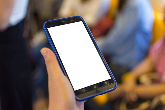 Person hand holding smartphone or mobile phone with white screen using in skytrain for checking