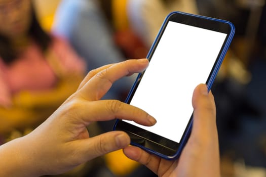 Person hand holding smartphone or mobile phone with white screen using in skytrain for checking