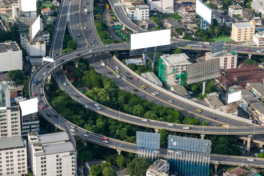 Cityscape and transportation with expressway and traffic in daytime from skyscraper of Bangkok. Bangkok is the capital and the most populous city of Thailand.