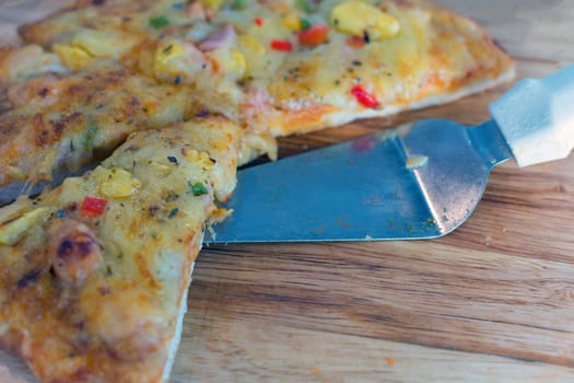 Pizza is a italian food served on wooden circle board