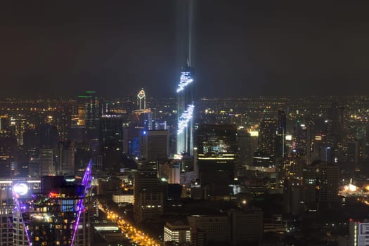 Cityscape Lightshow in grand opening tower on Silom is tallest buildings in  Bangkok Thailand.