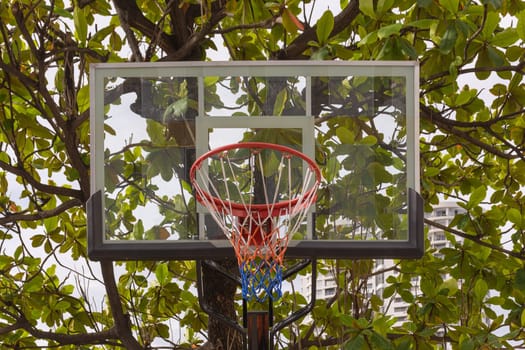 Basketball hoop make by wooden and ball in park