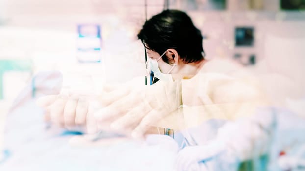 Asian women 40s years old in gown coat is a patient relative taking care of the CRE. or VRE. infected elder patient 80s years old on bed in the hospital.