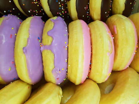 Sugar coated donut and sweet dessert food in donut and sweet dessert shop at Thai street food market