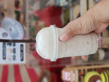 Bean spinning with milkshake smoothie (smoothy) for sale at Thai street food market or restaurant in Thailand