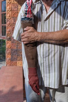 Asia elderly man have tanned skin disabled with one arm and arm prosthetic because accident