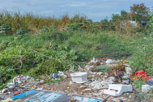Garbage and junk dump to the landfill in field it illegal, hazardous and dangerous for environment