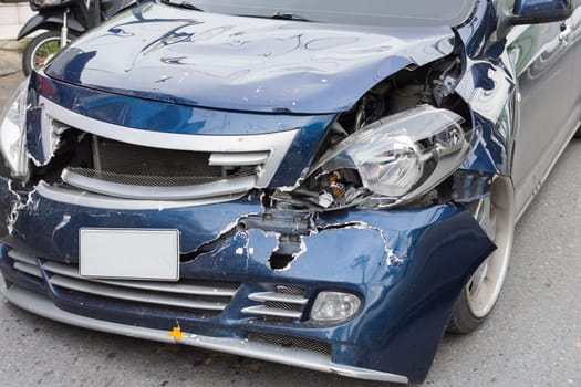 Car crash from car accident on the road in a city between saloon versus pickup wait insurance.