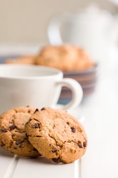 Chocolate chip cookies on a white table.