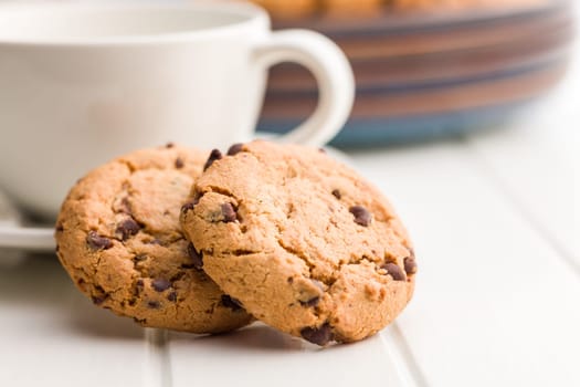 Chocolate chip cookies on a white table.