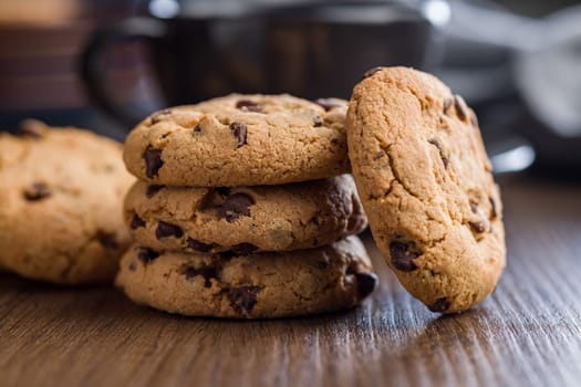 Chocolate chip cookies on a wooden table.