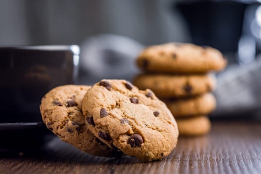 Chocolate chip cookies on a wooden table.