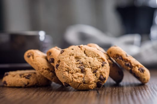 Chocolate chip cookies on a wooden table.