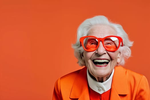 An elderly woman wearing oversized orange glasses and a matching vibrant outfit beams with joy - Generative AI