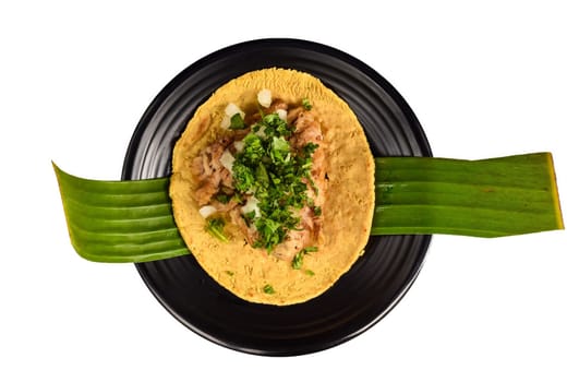 Tacos insurgentes with pulled pork and onion on black plate isolated on white background top view