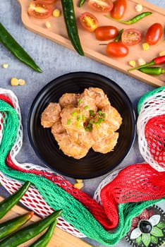 Reforma sriracha mayonnaise shrimps on table with mexican decorations