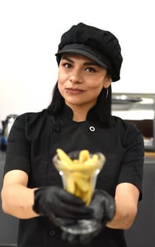 Mexican woman serving santa fe (caramelized banana with whisky) in mexican cafe
