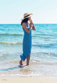 45 years old Russian woman  standing in Japanese sea and looking away