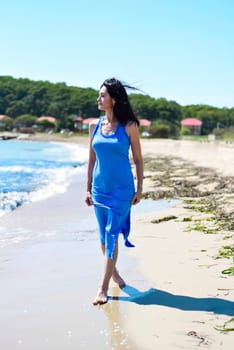 45 years old Russian woman  standing in Japanese sea and looking away