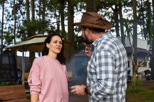 Smoking man and his wife arguing and talking