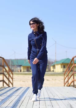 Cheerful 45 y.o. Russian woman running towards the camera and laughingCheerful 45 y.o. Russian woman running towards the camera and laughing