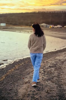 49 year old Russian woman walking toward to sunset view near japanese sea