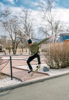 Young man riding a skateboard making tricks and jumps