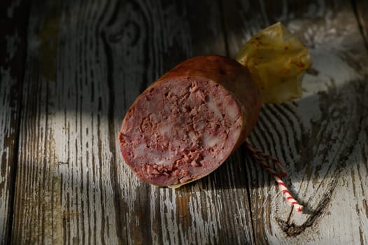 A beautiful piece of handmade meat showcases rich texture and craftsmanship, beautifully lit by soft evening light.