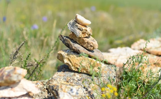 Rock balancing as a shamanism religion symbol in Olkhon island, Russia