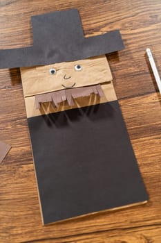 A dedicated teacher brings paper puppets to life, fostering creativity in the classroom through hands-on projects.
