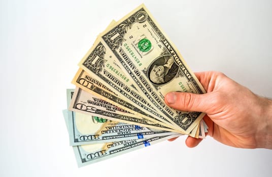 Hand holding money usa dollar isolated on white background