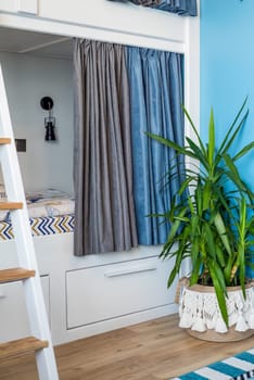 Blue curtains for bunk bed for boys in the bedroom without people