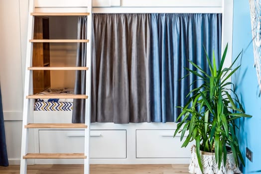 Blue curtains for bunk bed for boys in the bedroom without people