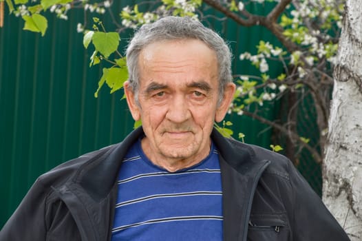 Portrait of Russian 70 years old man looking at camera