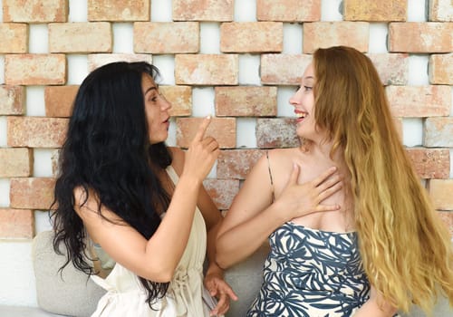 Russian beautiful blonde woman talking with her best friend
