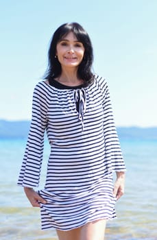 45 years old Russian woman laughing and standing in Japanese sea
