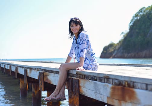 45 years old Russian woman smiling and looking at front against Japanese sea