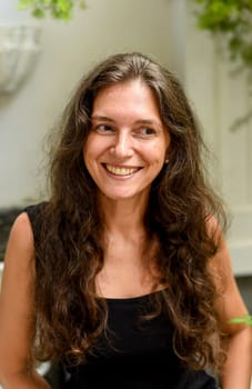 Portrait of 40 years old slavic woman close up without make up laughing and looking away