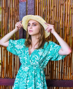 Beautiful Belarus woman in green dress with hatBeautiful Belarus woman in green dress with hat