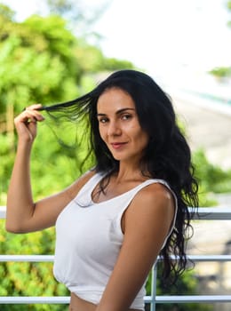 Portrait of sexy ukrainian woman touching her hair and looking down