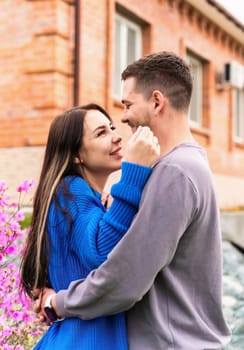 Young woman hugging her boyfriend, they are happy