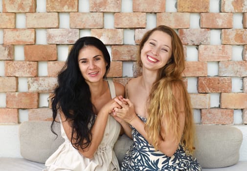 Russian beautiful blonde woman talking with her best friend
