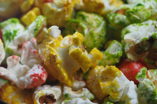 An assortment of vibrant popcorn in various flavors and colors is displayed.