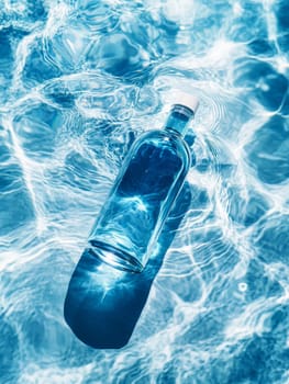 glass bottle of water on swimming pool background ..
