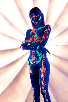 Woman girl with ultraviolet color pattern bodyart shot