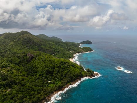 Aerial view of Mahe island with jungle and blue ocean. Seychelles.