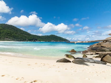 Tropical sandy beach and blue sea. Seychelles, Mahe. Police Bay beach.