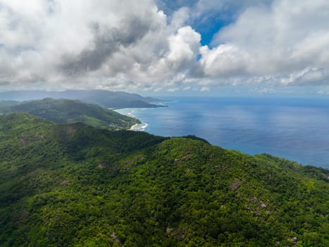 Aerial view of Coast of Mahe island with rainforest and blue ocean. Seychelles.