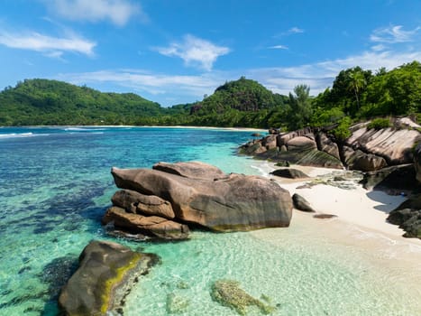 Sandy beach and beautiful rocks. Seychelles, Mahe. Baie Lazare Beach.